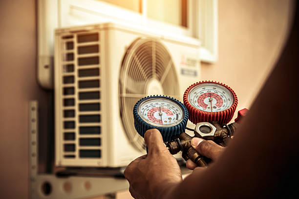 Professional Air Conditioning Service technician working in Green Camp, OH